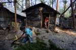 A family displaced from Kutubdia Island by rising sea levels makes a h...