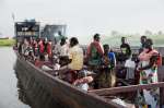 Photo shows other South Sudanese refugees aboard a boat in Ethiopia, N...