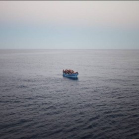 Italy. Seen very close to San Giorgio is the boat filled with people, most wearing life jackets.  (c) UNHCR / A. D'Amato / June  2014.