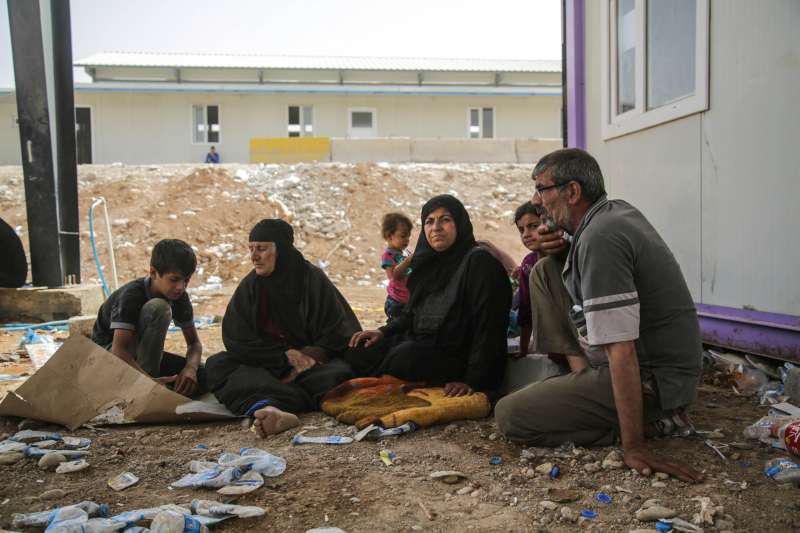 Bushra (centre right) rests with her husband and family members [&hellip;]