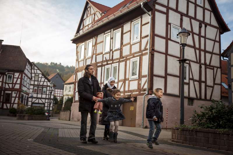 The Khawan family walks through their new hometown, Wächtersbach, [&hellip;]