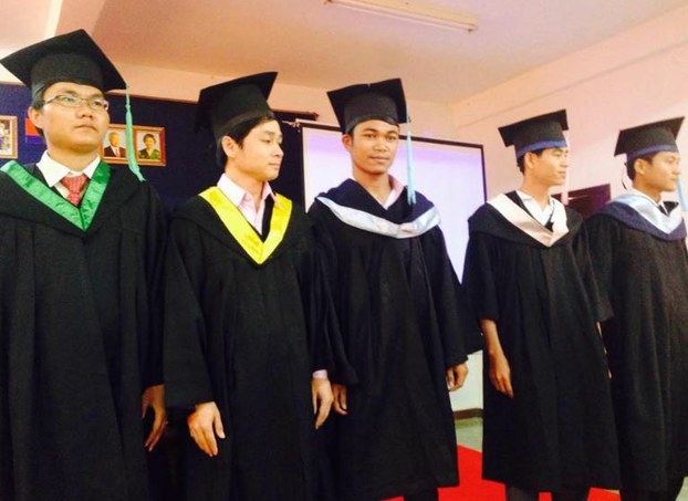  Tao Savoeun (center) poses with unnamed classmates during his graduation in Siem Reap, September 26, 2015.