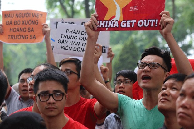 Vietnamese protesters shout slogans in front of the Chinese embassy during a rally in Hanoi, May 11, 2014.