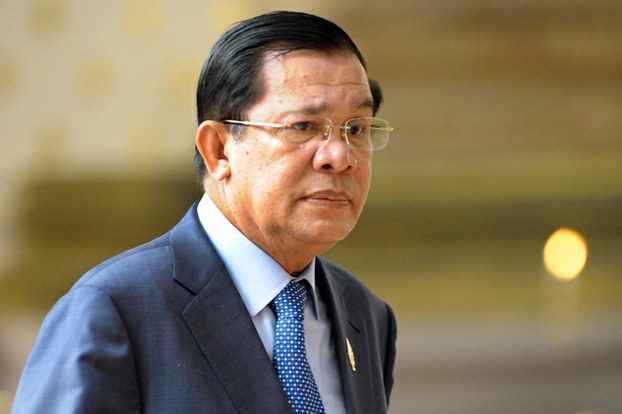Cambodian Prime Minister Hun Sen walks into a National Assembly meeting in Phnom Penh, March 19, 2015