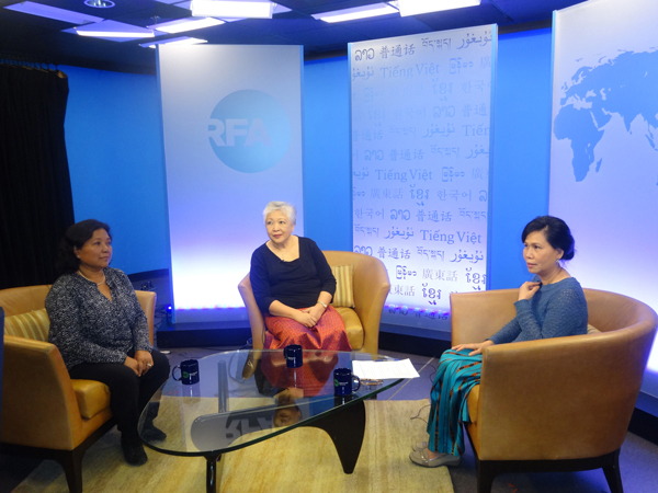 Activists Thida Khus (C) and Sopheap Ros (L) prepare to be interviewed by RFA's Cambodian Service in Washington, March 16, 2015.