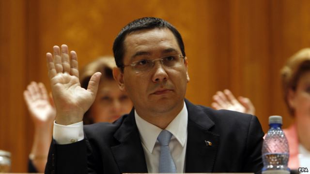 Romanian Prime Minister Victor Ponta votes at the opening of a no-confidence motion in front of the parliament in Bucharest on June 12.
