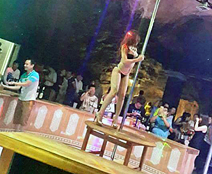 A pole dancer performs at the nightclub inside Viengsay cave in Houaphanh province, northern Laos, Aug. 21, 2015