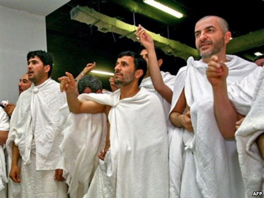 Iranian President Mahmud Ahmadinejad (center) throws stones at a column symbolizing the devil in Mecca.