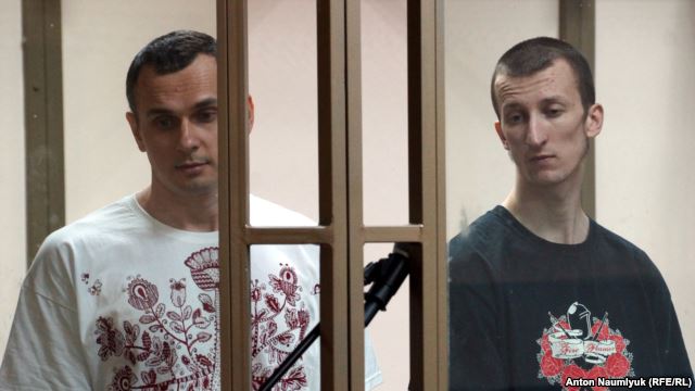 Ukrainian film director Oleh Sentsov (left) and co-defendant Oleksandr Kolchenko appear in court on July 21.