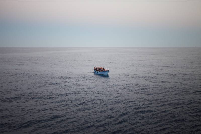 Italy. Seen very close to San Giorgio is the boat filled with people, most wearing life jackets.  (c) UNHCR / A. D'Amato / June  2014.