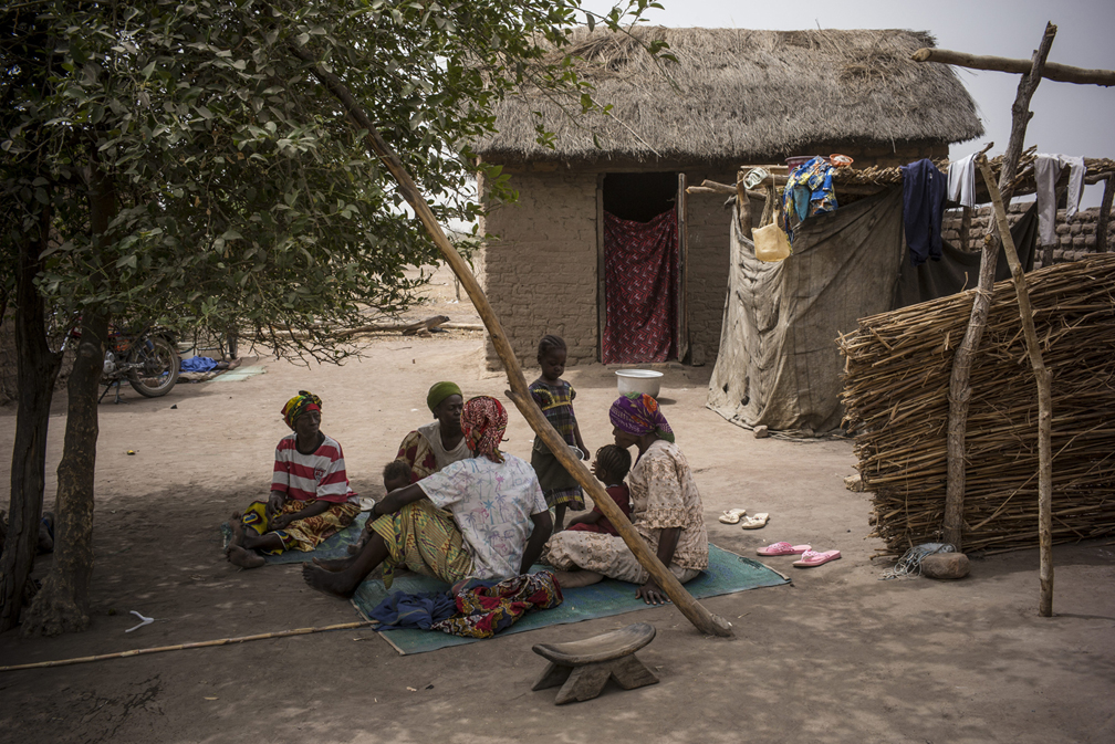 A  refugee family from the Central African Republic rests in front of their new home in Diligala village in southern Chad. Touched by their complete destitution, a local villager gave them the house in solidarity.  The refugees hastily fled turmoil in their country and arrived in Chad with very few belongings, many had first nowhere to stay. UNHCR / Olivier Laban-Mattei