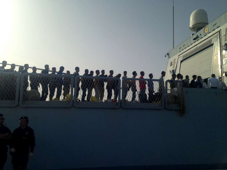 Refugees and migrants rescued from a shipwreck by the Italian Coastguard disembark in  
Porto Empedocle, Sicily last weekend.