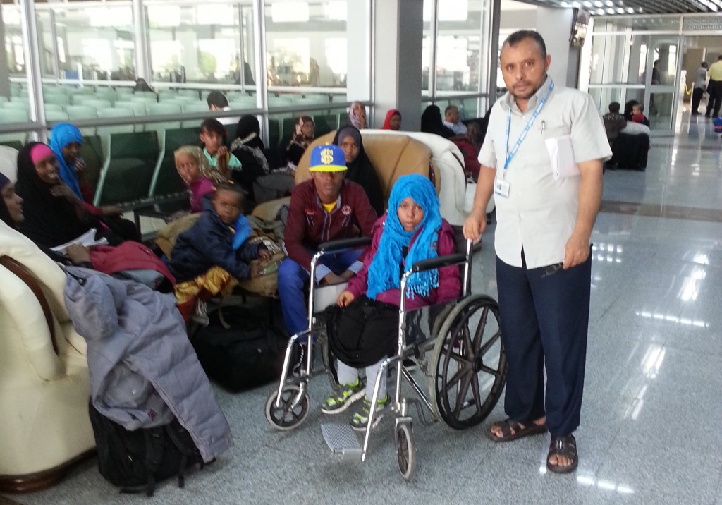 Bushra,  happy and excited, at the airport with Ahmed Binsheba from UNHCR, Yemen. (c) UNHCR/2014.