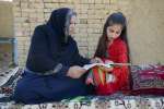 Sawera Niazmand, eleven years old, is the youngest daughter of Aqeela Asifi, and a student at her mother's school. Education has given her hope for a life beyond the confines of the refugee village. "My dream is to become an eye doctor," she says, "to bring light to people who cannot see." 