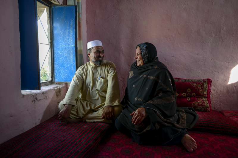 Asifi with her husband Sher Muhammad in their home. He has championed her work with refugee girls from the beginning: "In the future I would like [the schools] to go beyond 8th grade and include technical schools, so they can play a positive role in the development of Afghanistan," says Muhammad. 
