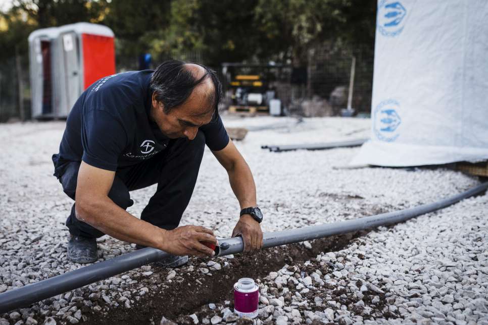 Greece. Building of WASH (Water, Sanitation and Hygiene) facilities by UNHCR implementing partner Samaritan's Purse at the Sikaminea assembly point