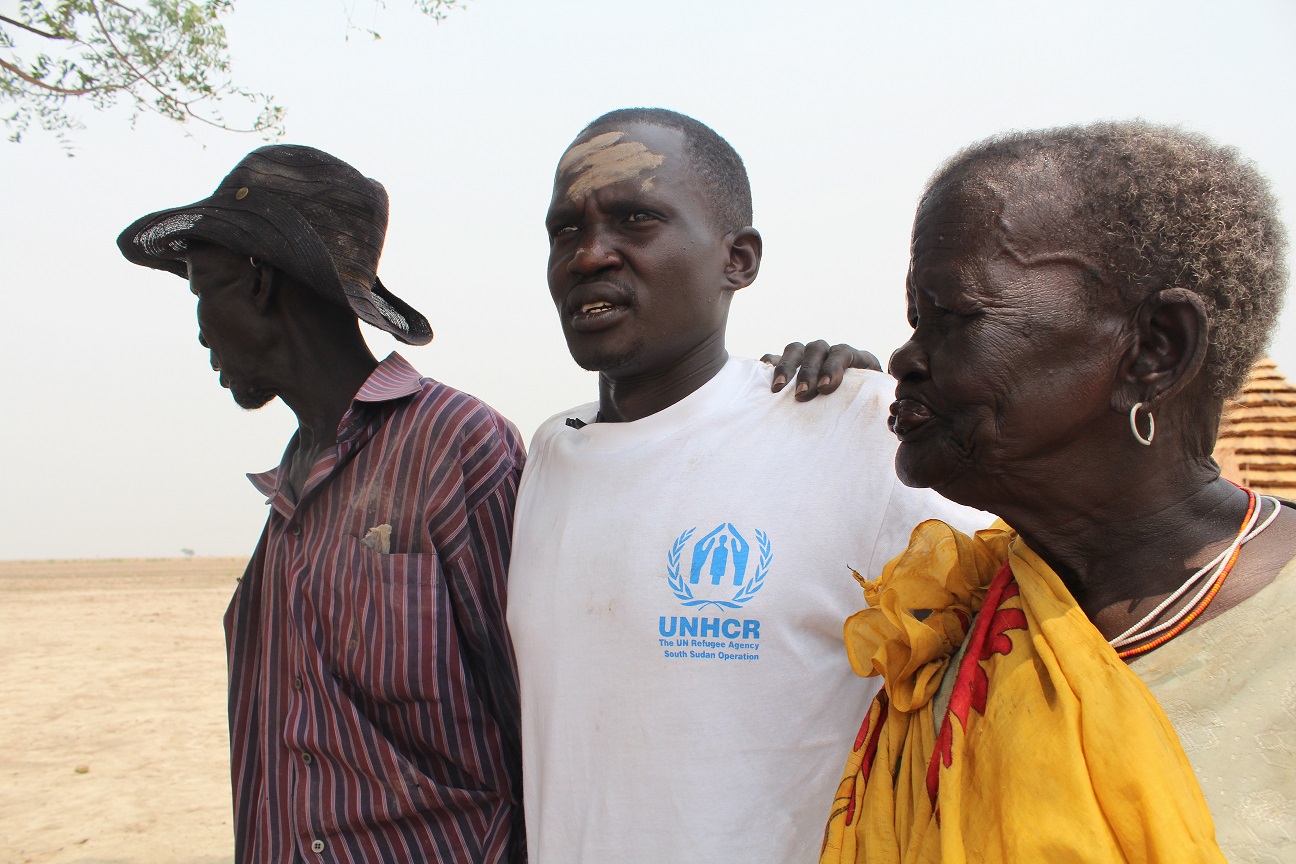 Guor z rodzicami. Zdjęcie: UNHCR/T. Ongaro/2013.