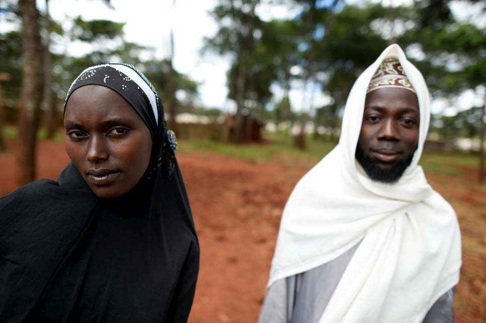 Abdul Yamuremye, 32, and his wife, Hadija Umugure, 25, return from the open-air mosque in Nduta refugee camp. They fled violence in Burundi.