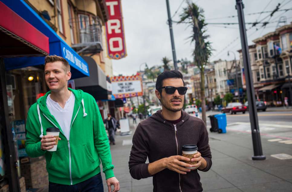 Subhi Nahas, a 28-year-old refugee from Syria (right), walks with his American partner, Mark Averett, in the Castro District of San Francisco.