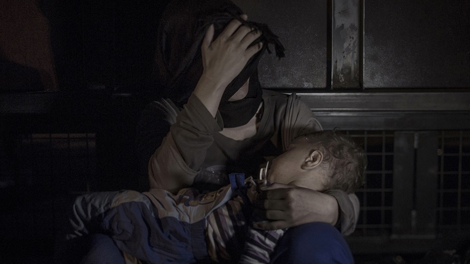 At the front of the border between Serbia and Hungary, next to the 13-foot-tall iron gate, Sham is laying in his mother's arms. Just a few inches behind them lies the Europe they are so desperately trying to reach. They now wait for a better future, along with thousands of other refugees.  