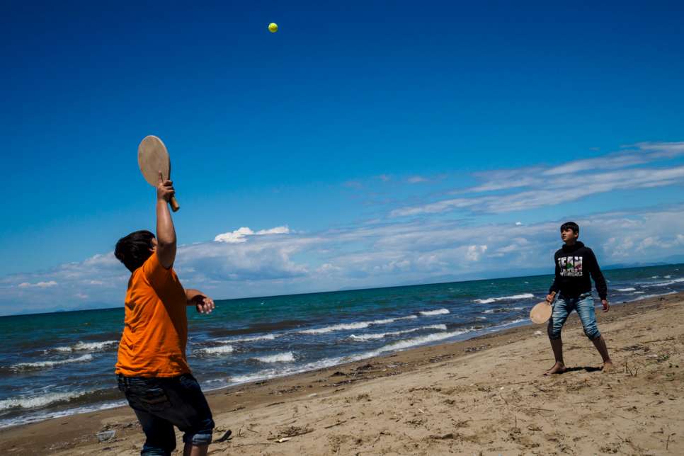 Two boys play a game on the beach at LM Village, in Greece's Peloponnese region.
