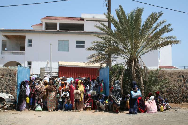 Somalis and Ethiopians crowd outside the Djibouti Refugee Agency office in the capital, Djibouti.
