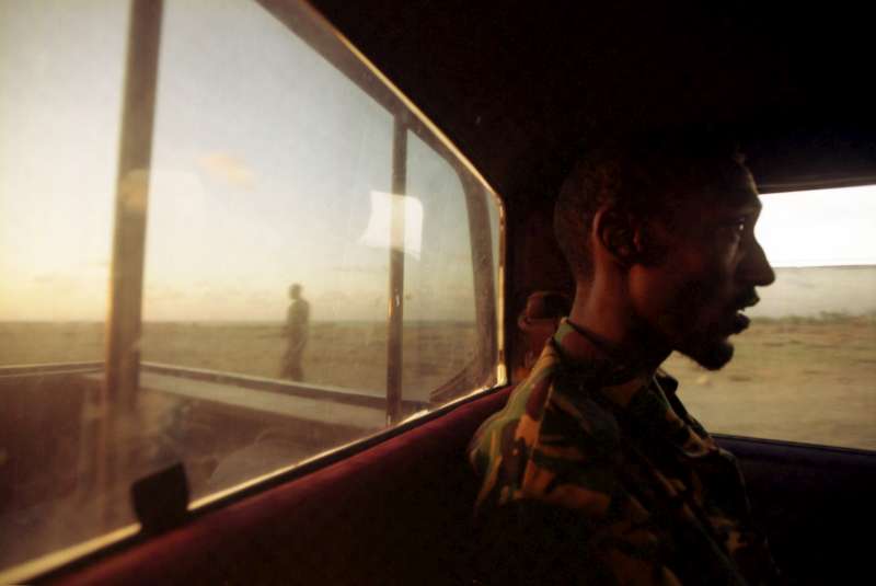 A police patrol car makes its way along the Puntland coast road on the look out for arms and people smugglers.
