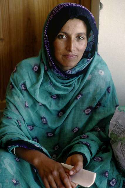 A Saharawi refugee from Western Sahara holds her identity documents. 