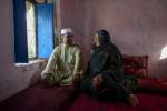 Asifi with her husband Sher Muhammad in their home. He has championed her work with refugee girls from the beginning: "In the future I would like [the schools] to go beyond 8th grade and include technical schools, so they can play a positive role in the development of Afghanistan," says Muhammad. 