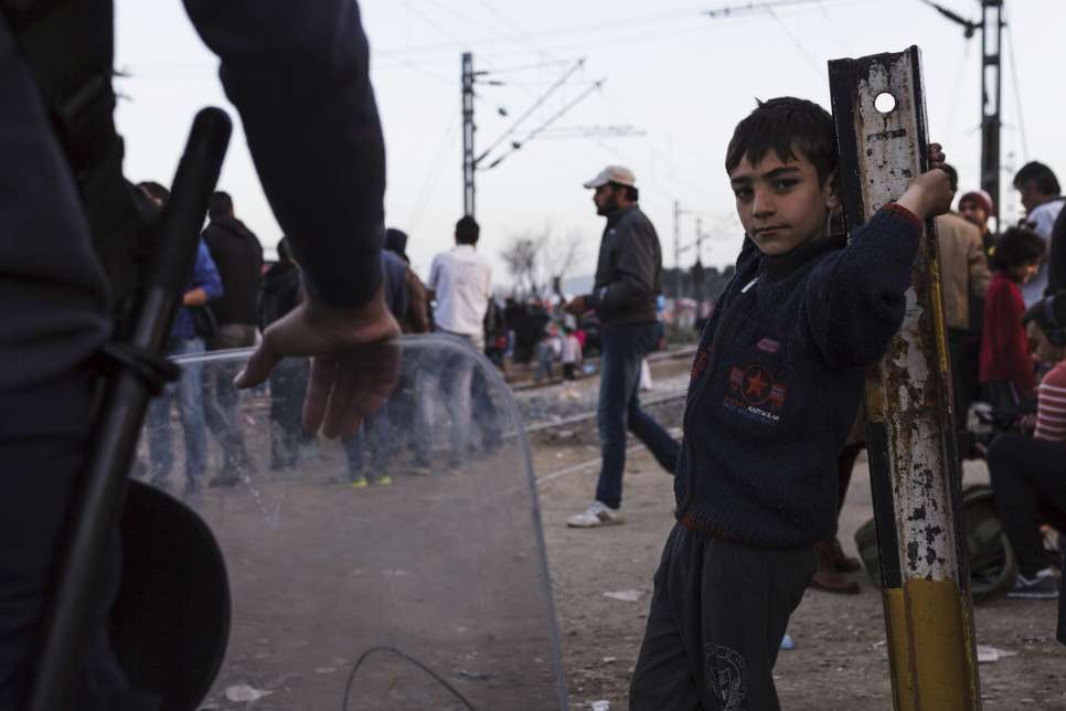 A young boy from Syria waits near Idomeni on the border between Greece and the Former Yugoslav Republic of Macedonia.

As part of a joint endeavour to step up protection for the growing numbers of children and others with specific needs arriving in Europe, UNHCR, the UN Refugee Agency, and UNICEF are setting up special support centres for children and families along the most frequently used migration routes in Europe.

Twenty Child and Family Support Hubs, to be known as "Blue Dots," will provide a safe space for children and their families, vital services, play, protection and counselling in a single location.