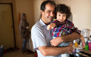 Nader, 41, and his son Ahmed, 3, in their apartment in Bangkok, Thailand. (c) UNHCR/R. Arnold/2015