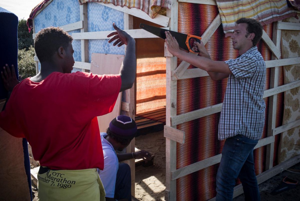 Julien Bélart, 22, provides wood, tools and other materials for refugees and migrants and helps them build shelters in the so-called Jungle near Calais, France.
