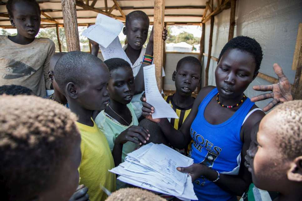 Racheal Athieng, 20, was forced to flee her home in Twic East, South Sudan. She settled in Mingkaman and now teaches a class of fellow Internally Displaced People (IDP) at the newly-built school. "Women teachers have the advantage that they identify the slow-learners and encourage them," she says. "Men don't do that as much. Women are more caring, not as harsh as the men."

Her parents supported her all the way to the end of her education, something that she says is rare. "After a certain age, many parents see their girls only as people to do domestic chores, then to be married to bring the financial benefits of a dowry to their parents," she says. "It is a shame."
