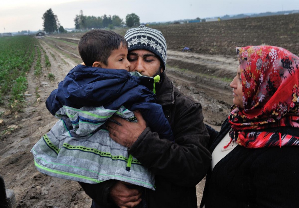 Naasan, a Syrian refugee, clings to his four-year-old son, Muhamad. He and his wife lost the boy in a crowd at the border between Serbia and Croatia. It took four days, but UNHCR and Red Cross staff on both sides of the border worked together to reunite the boy with his parents.