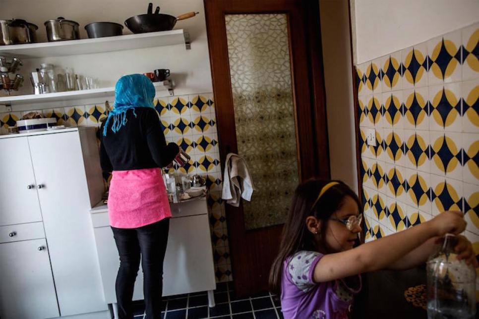 The Camastra family prepare Turkish coffee in the kitchen of their apartment in Catania.