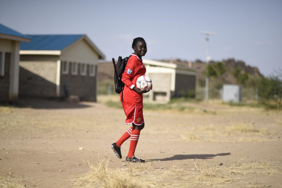 "I like football because it helps me to relax. It is a very popular sport in the camp," Esther says.