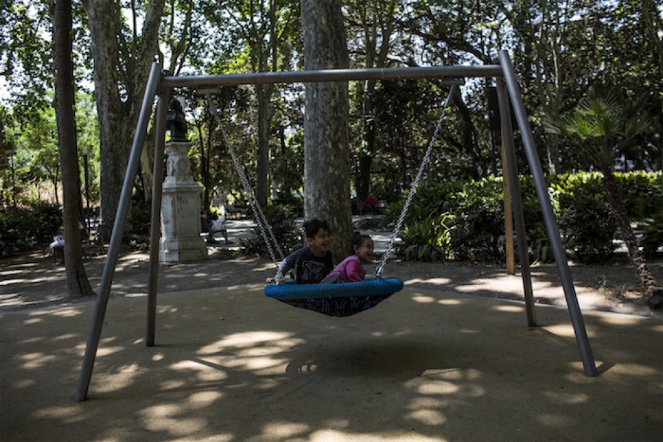 Four-year-old Lyad and his three-year-old sister, Liain, play at a children's garden in Villa Bellini in Catania, Italy.