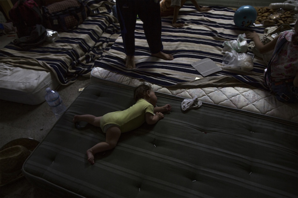 A Syrian baby rests in the attic of the central mosque in Catania, Italy, where Mohammed and his family are staying.