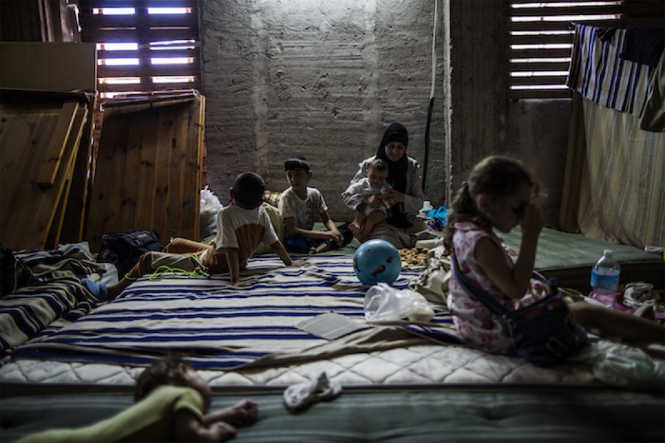 Syrian refugees rest in the attic of the central mosque in Catania, Italy, which is used as a dormitory for new refugees.