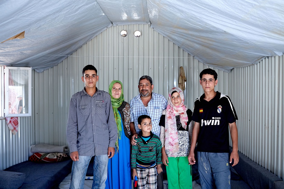 Amer (left) with his parents and siblings in their shelter at Azraq refugee camp in Jordan. "When we don't have proper light, the shadows play games and you imagine the worst."