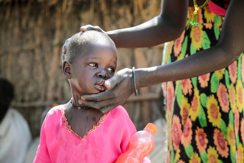 Despite reaching safety after a week of walking, children like Nyaniel are still traumatised by their hardships. Her mother, Nyagay Riak, comforts her daughter as best as she can.