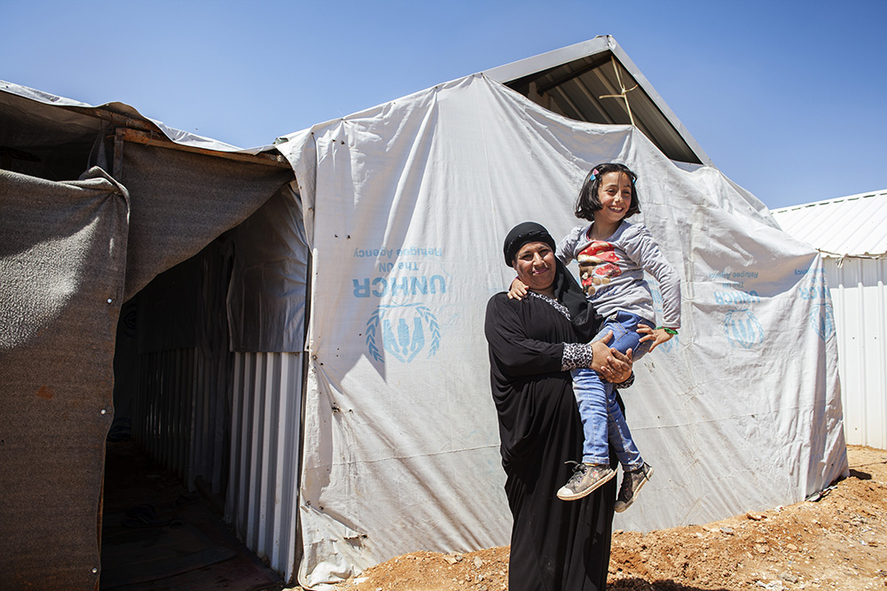 Jordan. Nine-year-old Syrian refugee, Solaf, with her mother Ruwaidah, 44, at Azraq refugee camp