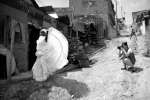 Helena photographs Maribeth dancing outside her house.
