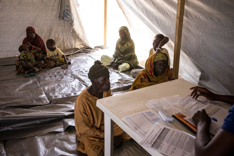 Moussa Gapchia and Falmata Mohamed register their family with UNHCR at Dar-es-Salam settlement in Chad. They arrived a day earlier, after five weeks on the run.