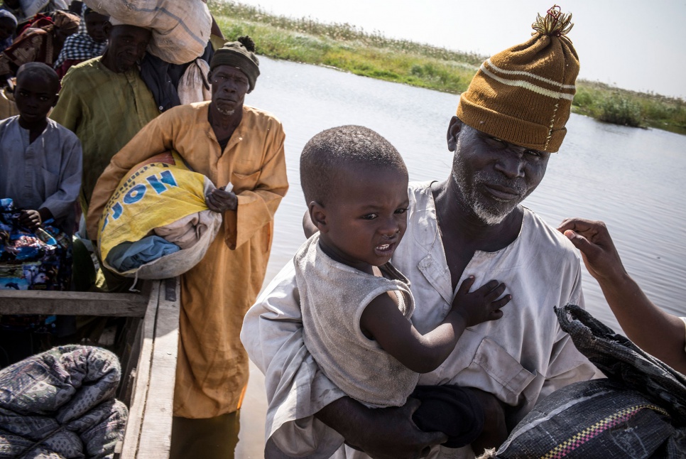 Nigerian refugees arrive in Baga Sola, Chad, on 8 February 2015. They are then taken to the Dar-es-Salam settlement, in a safer area 12 kilometres away.