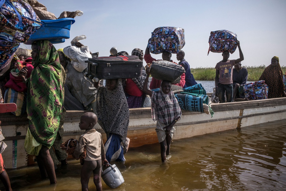 Nigerian refugees arrive exhausted in Baga Sola, Chad. They survived for weeks by drinking water from the lake, fishing for food and getting help from a few local residents.