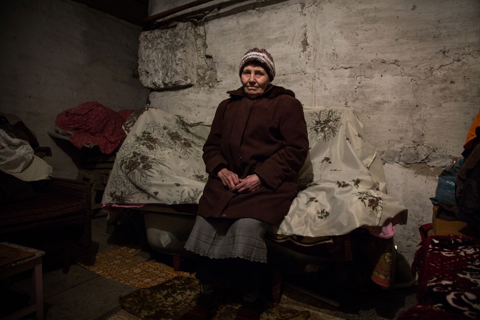 Katia sits on a bathtub covered with a board and a thin mattress in a basement in Donetsk, Ukraine. "It's not comfortable sleeping but it's better than sleeping in the street."