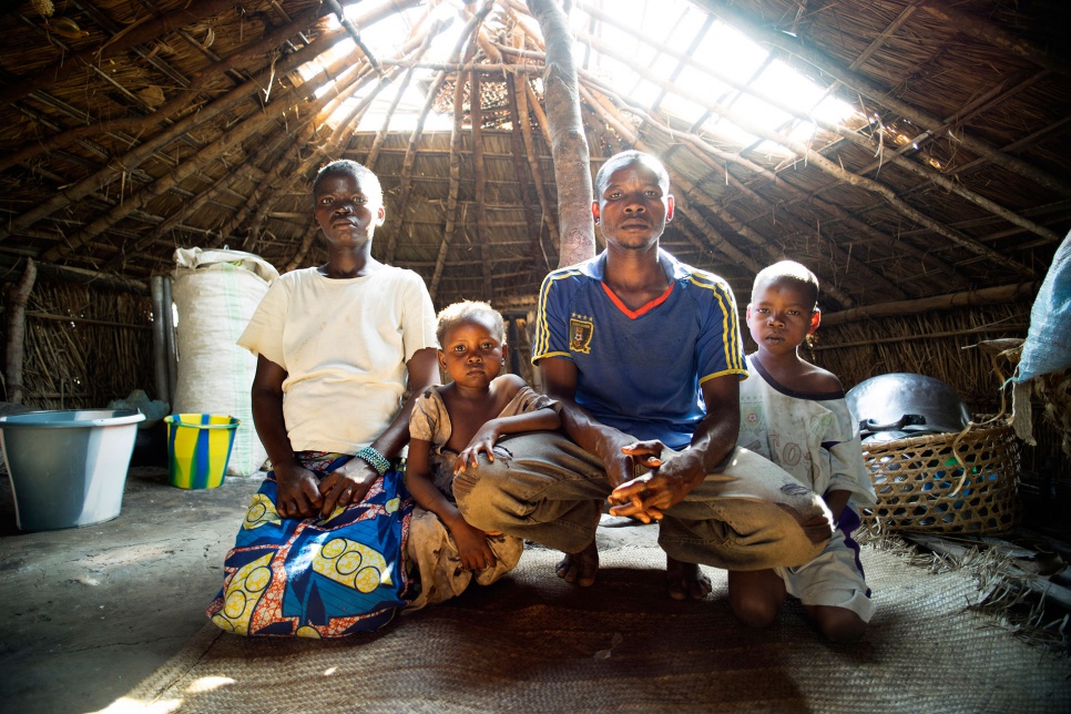 Natacha, 24, with her two surviving children and her husband, Achille, 25, inside the family's shelter in Gbadakila spontaneous site, Equateur, DR Congo.