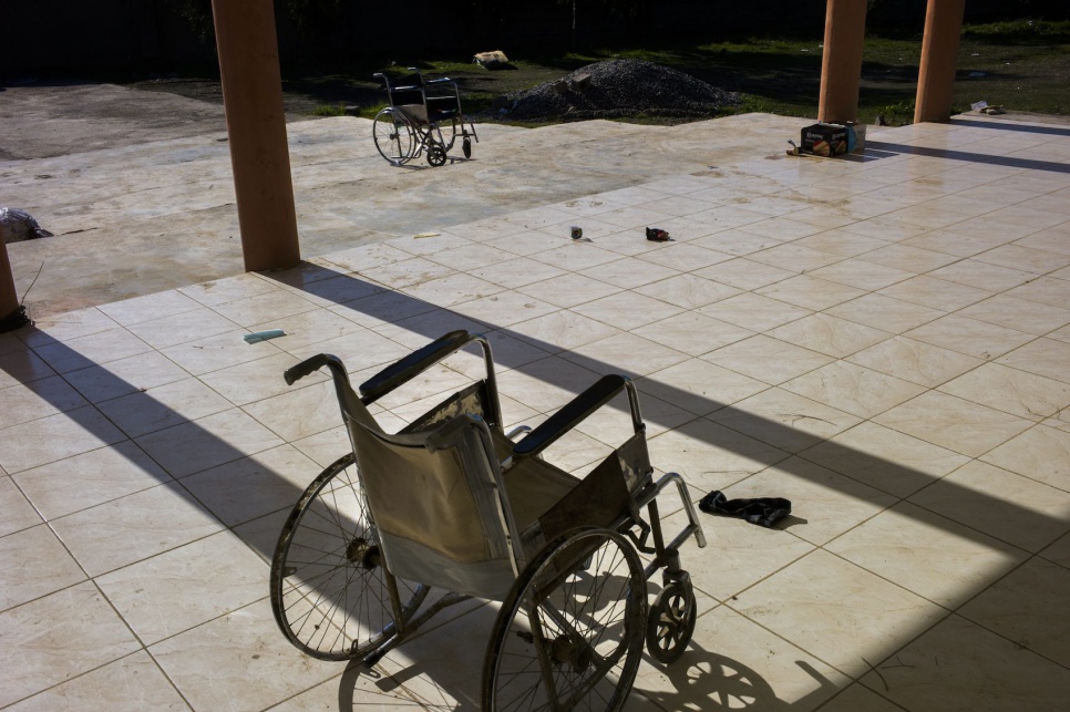 Two wheelchairs are discarded after 196 internally displaced people from the Yazidi religion community are released and find shelter at Lalish Temple.
