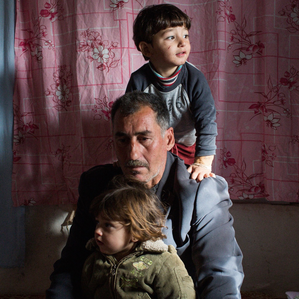 Mohammed, seen here with young Ali, 3, and Gulay, 2, worries about his family's future. "I stay up until two or three in the morning. Sometimes I can't sleep until dawn."